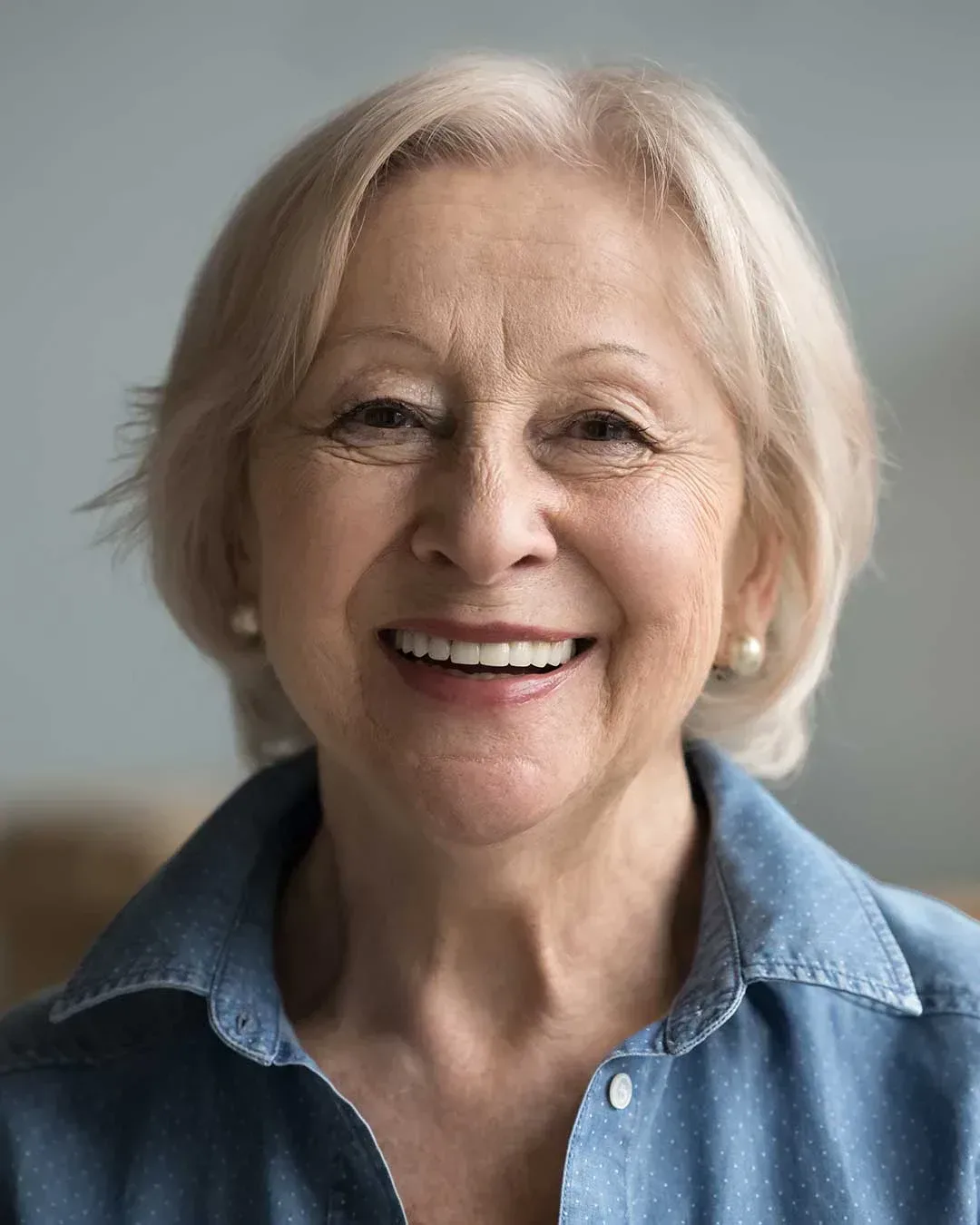 Lovely elderly woman with a smile restored with full dentures